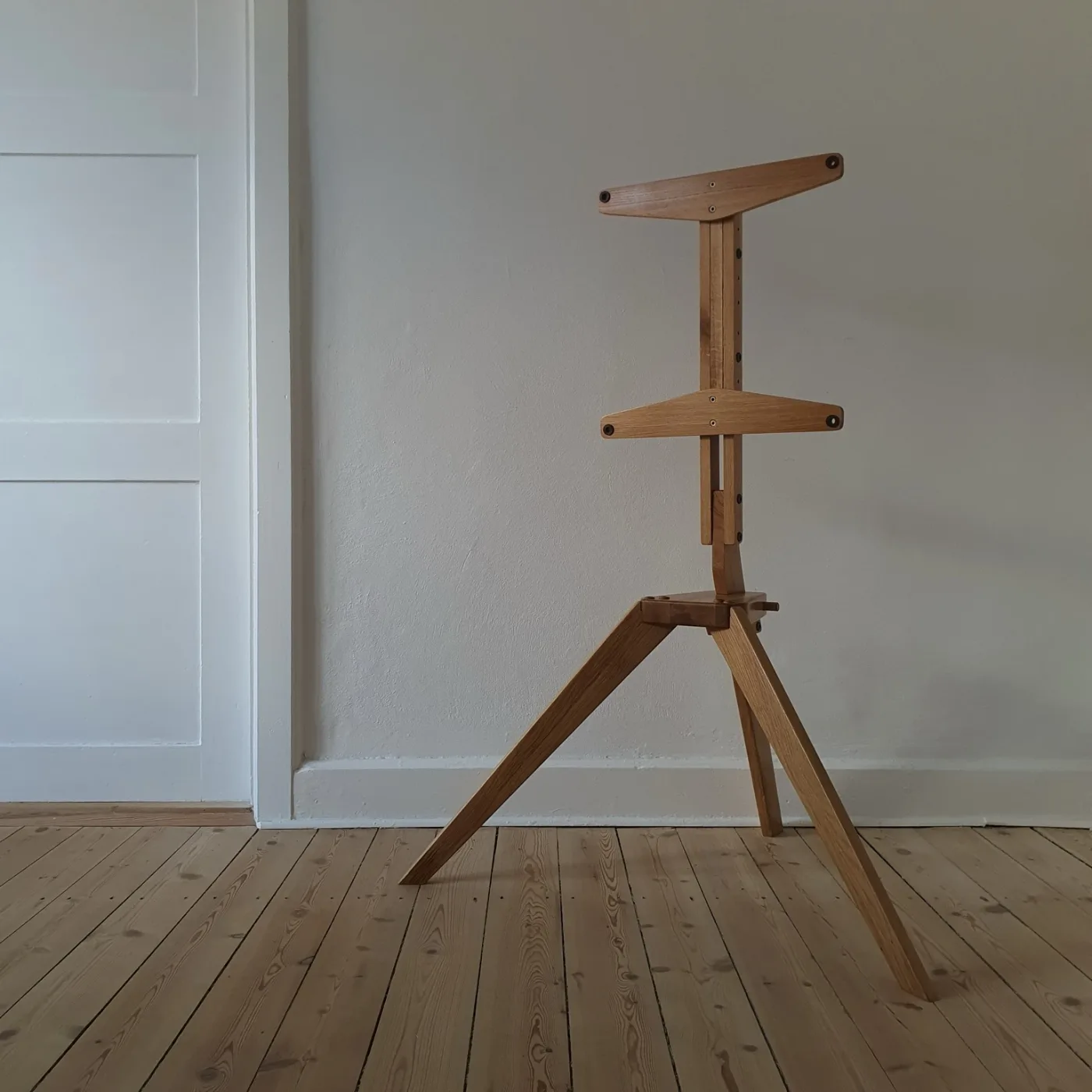 Wooden TV stand prototype, co-designed with my father, tripod base and easel arms, empty